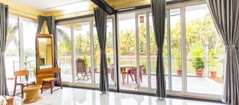 Riverside Retreat HomeStay – AC Studio with Breakfast Option & Boat Ride