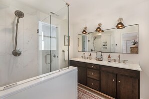 Shower, hair dryer, towels, toilet paper