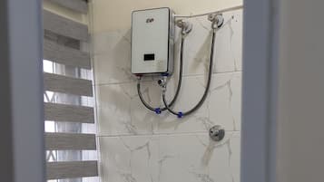 Shower, towels, soap, toilet paper
