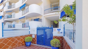 A building with a blue gate labeled "Portal 1" and "Portal 8".