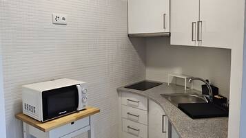 Fridge, microwave, stovetop, coffee/tea maker
