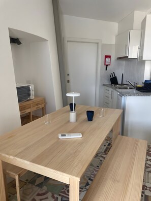 Fridge, microwave, coffee/tea maker, cookware/dishes/utensils
