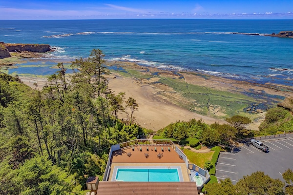 With picturesque views of the sandy beach and rocky shoreline, the pool area offers a relaxing retreat in a scenic natural setting.