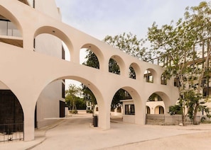 A building with multiple arches and a courtyard.