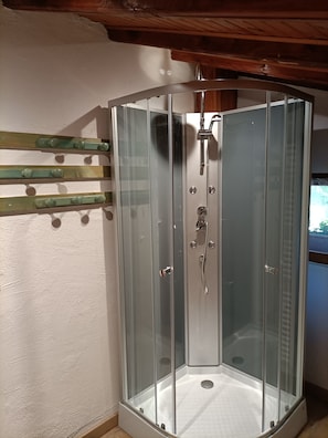 Shower, hair dryer, towels, toilet paper
