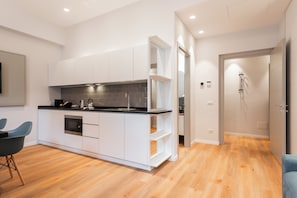 Appartement Deluxe, vue cour intérieure | Coin séjour