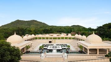 A large, open courtyard with multiple domed structures and a central fountain.