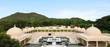 A large, open courtyard with multiple domed structures and a central fountain.