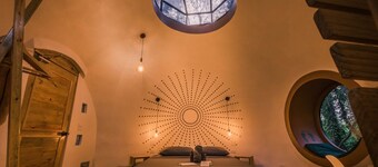 Dome shaped bungalow in a lush tropical forest, steps away from ocean views.