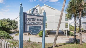 A sign for Cotton Bayou Condominiums indicating private property for owners and guests only.