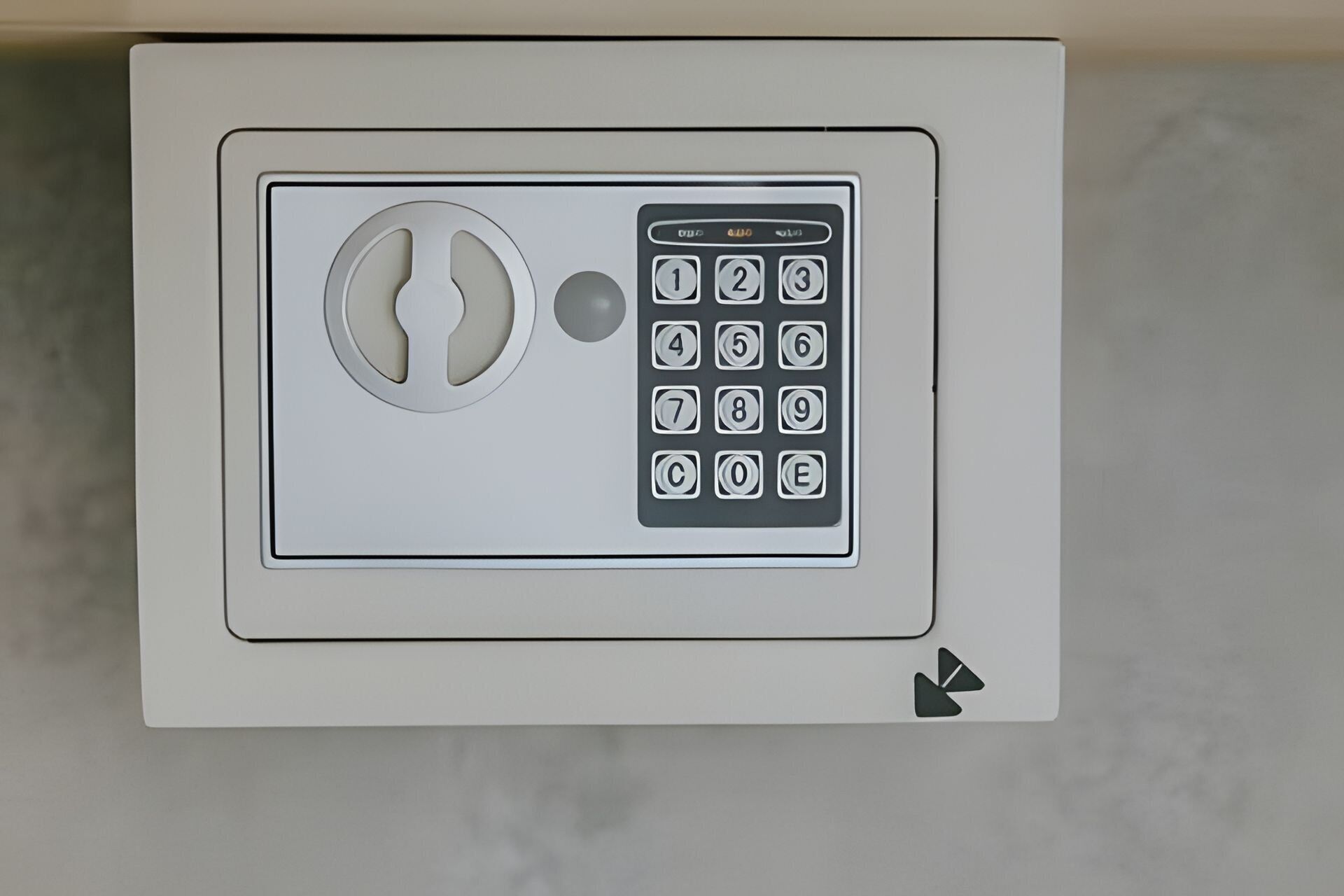 A keypad lock with a keyhole and a numeric keypad.