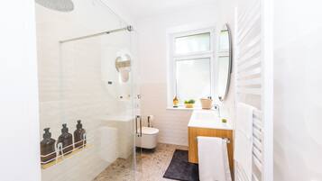 Shower, hair dryer, towels, soap