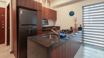Fridge, stovetop, cookware/dishes/utensils, dining tables