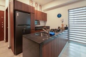 Fridge, stovetop, cookware/dishes/utensils, dining tables