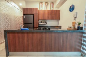 Fridge, stovetop, cookware/dishes/utensils