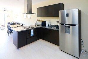 Fridge, microwave, stovetop, coffee/tea maker