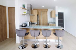 Fridge, microwave, stovetop, coffee/tea maker