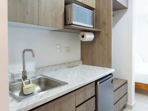 Fridge, microwave, stovetop, coffee/tea maker