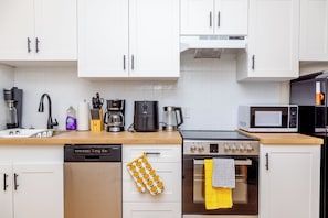 Premium Suite, 1 Queen Bed, Non Smoking, City View | Private kitchen | Fridge, microwave, oven, stovetop