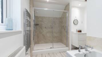 Shower, hair dryer, towels, soap
