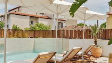 Seasonal outdoor pool, pool umbrellas, pool loungers