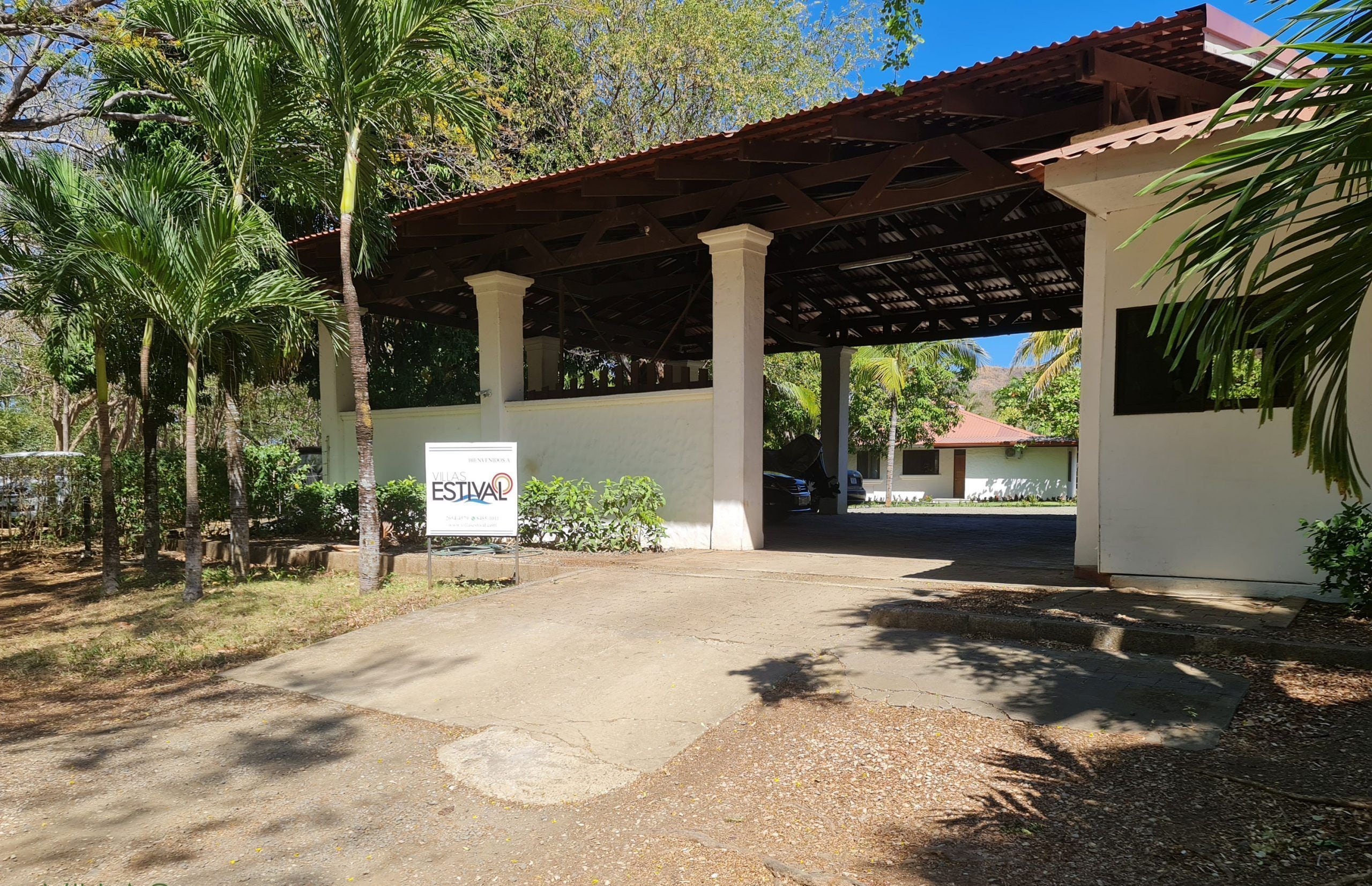 A covered outdoor area with a sign for 'Villas Estival'.