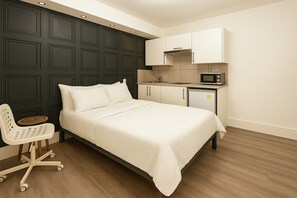 1 bedroom, desk, iron/ironing board, travel crib