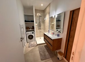 Shower, hair dryer, towels, soap