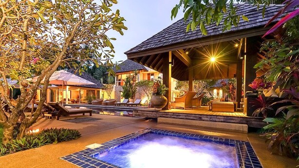 A spa area with a hot tub, lounge chairs, and a covered seating area. - Villa Samakee (Choeng Thale)