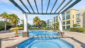 Unclassified image, 3 of 15, button - Steps to the Sand Family Pools Patio for Grill (Loiza)