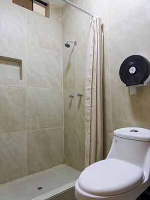Shower, towels, soap, toilet paper