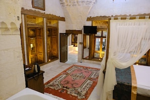 Luxury Studio Suite, Balcony, Courtyard View | Desk, laptop workspace, free WiFi