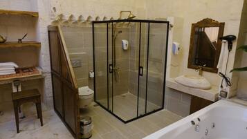 Luxury Studio Suite, Balcony, Courtyard View | Bathroom | Separate bathtub and shower, hair dryer, slippers, towels
