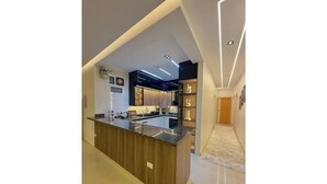 A modern kitchen with a central island, built-in appliances, and recessed lighting. - Lux privat hjem Sheikh zayed (Second Al Sheikh Zayed)