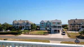 A beachfront property with multiple houses, a driveway, and a basketball court. - Semi-Oceanfront, Priv Pool, Hot Tub, ELEV, Rec Rm-WL980, OBX Beach Bliss (Corolla)