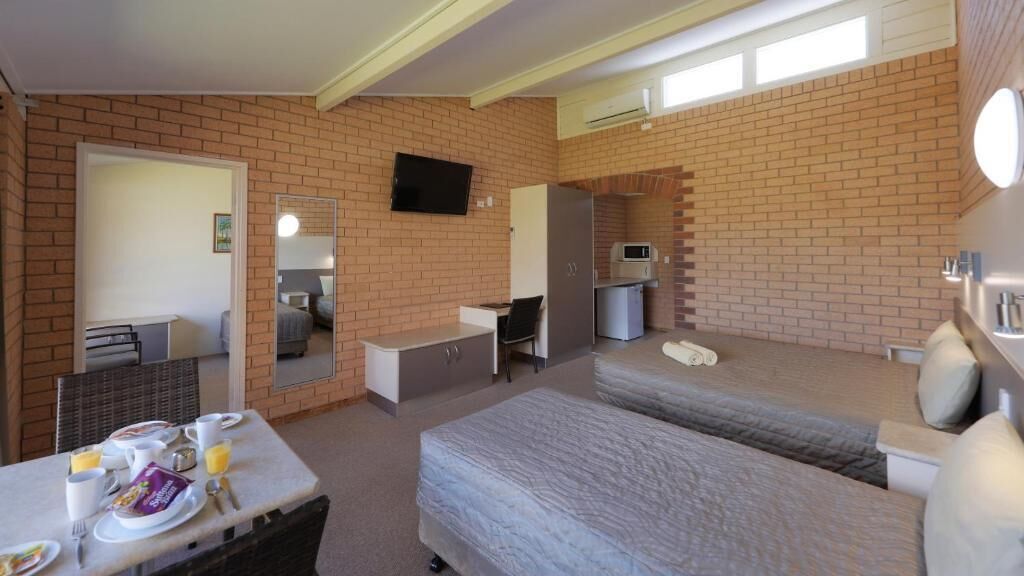 Family Suite, Garden View | Desk, iron/ironing board, free WiFi