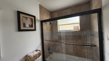Shower, hair dryer, towels, toilet paper