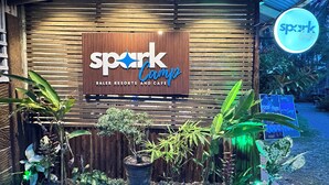 A wooden facade with a sign for Spark Camps at Baler Resorts and Cafe. - Spark Camp - Baler (Baler)