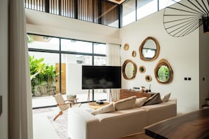 Luxury Four-Bedroom Pool Villa | Living area | 40-inch flat-screen TV with cable channels