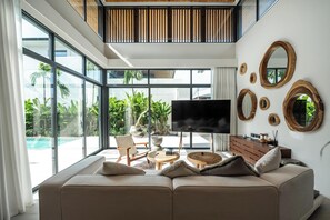 Luxury Four-Bedroom Pool Villa | Living area | 40-inch flat-screen TV with cable channels - Elite Chalong Villas (Chalong)