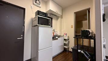 Apartment | Private kitchen | Full-size fridge, microwave, oven, stovetop