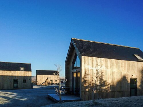 Modern comfort meets rugged wilderness at Tarset Tor’s unique glamping retreat.