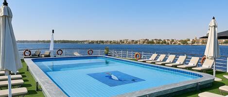 Outdoor pool, pool umbrellas, pool loungers