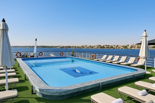 Outdoor pool, pool umbrellas, pool loungers