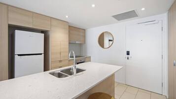 Deluxe Apartment, Air conditioning, Ocean View | Private kitchen | High chair