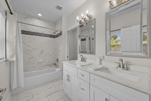 Shower, hair dryer, towels, shampoo