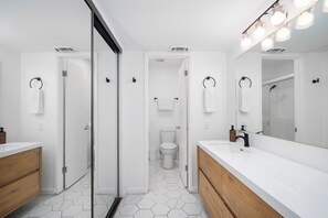Shower, hair dryer, towels, soap