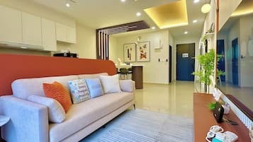 Deluxe Apartment, 3 Bedrooms, Balcony, City View | Living area | Flat-screen TV