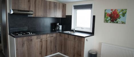 Fridge, coffee/tea maker, cookware/dishes/utensils