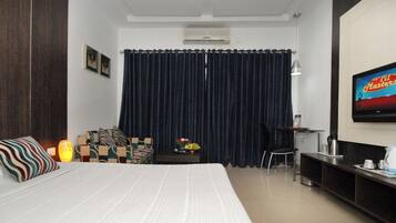 Deluxe Double Room, Balcony, Pool View | Minibar, in-room safe, desk, free WiFi